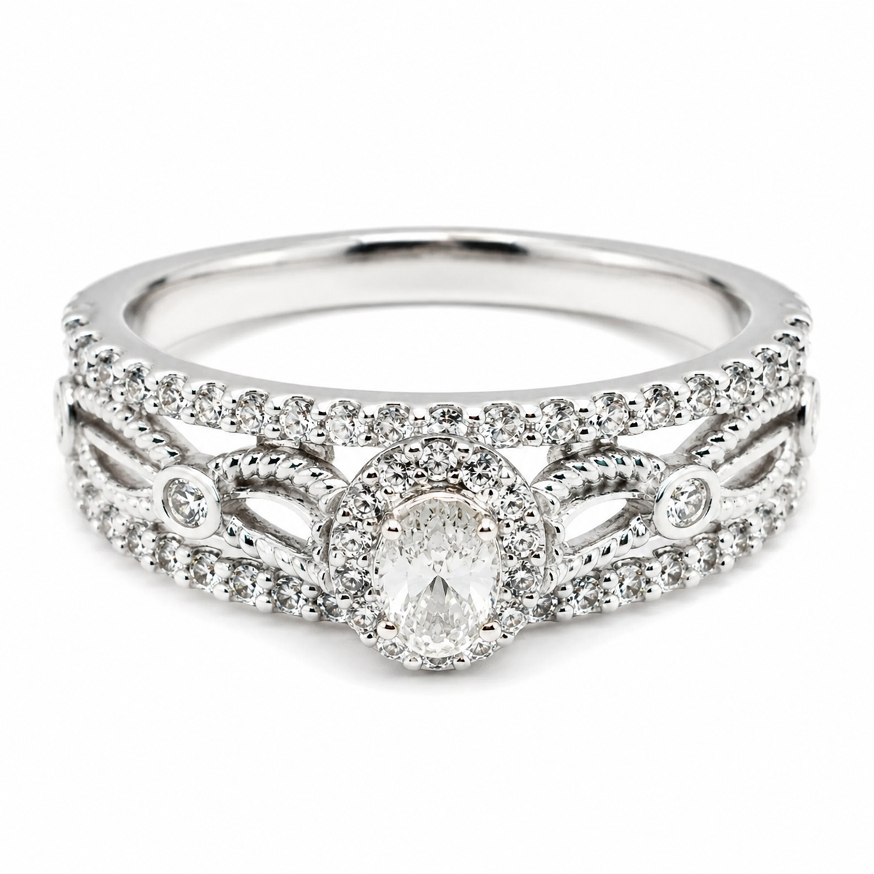 9ct white gold oval cut diamond halo engagement ring with intricate split shank and pave diamond accents by Cassim and Co
