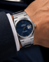 Close-up of blue dial with applied luminous markers and cyclops date window