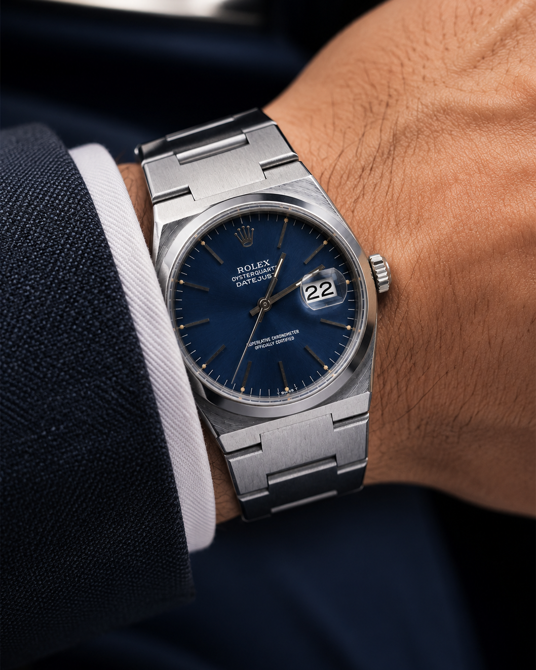 Close-up of blue dial with applied luminous markers and cyclops date window