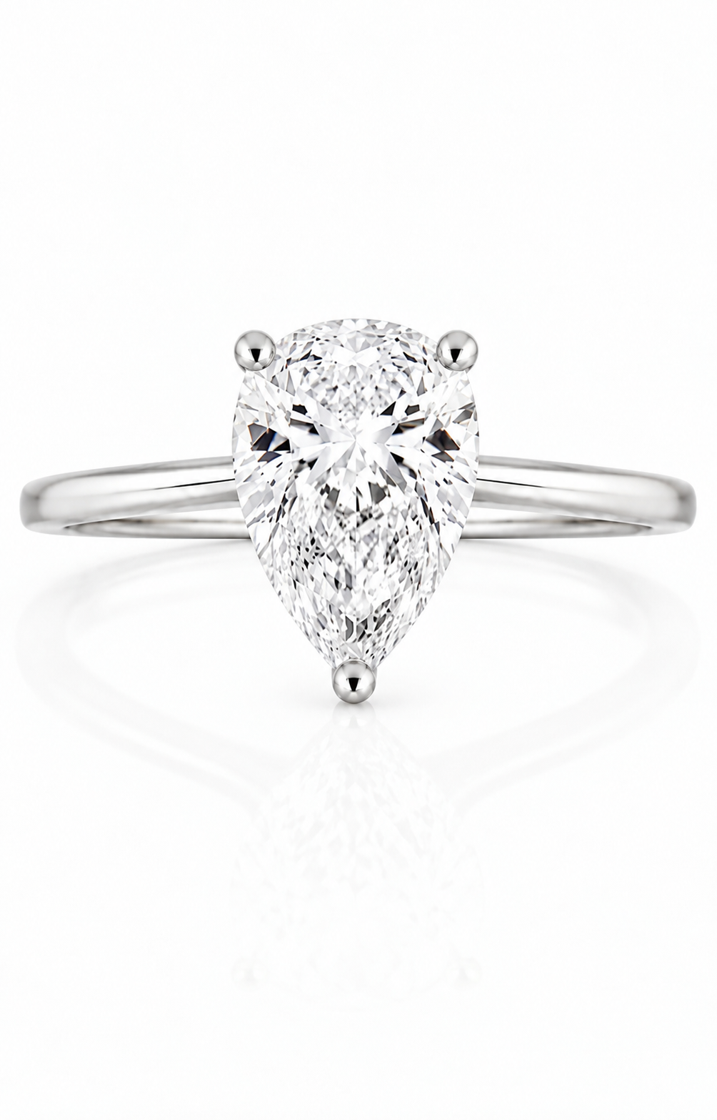 9ct white gold engagement ring with 1.5ct pear shape lab grown diamond in three-prong solitaire setting, viewed from above on white background