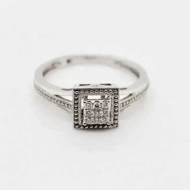 9ct white gold princess cut diamond halo ring with milgrain detailing and pave set shoulders