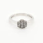 9ct white gold diamond flower cluster ring on white background showing brilliant cut diamonds in floral setting
