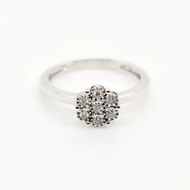 9ct white gold diamond flower cluster ring on white background showing brilliant cut diamonds in floral setting