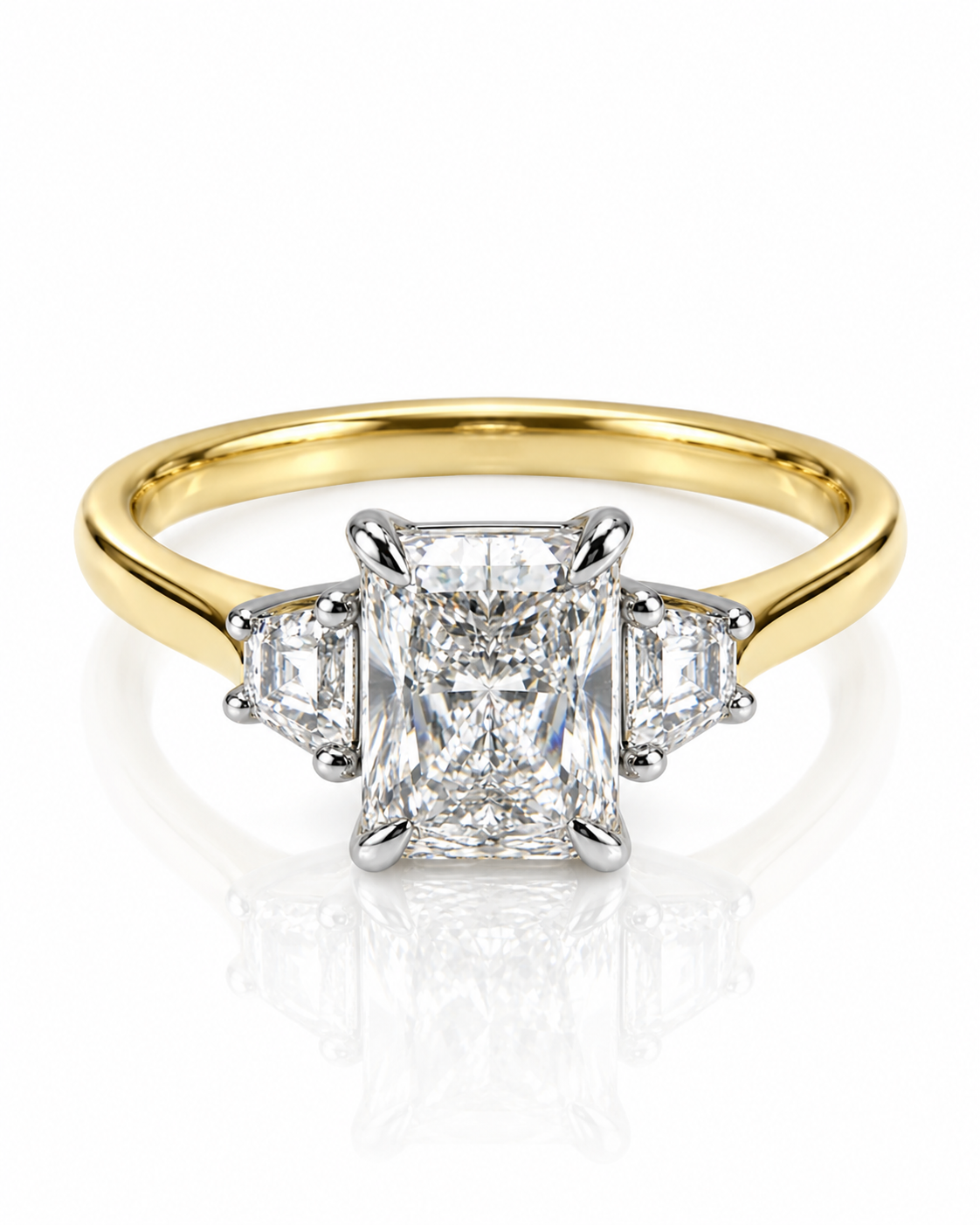 9ct yellow gold three stone engagement ring with 1.2ct elongated radiant cut lab grown diamond and asscher side stones from Cassims & Co.