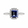 9ct white gold emerald cut tanzanite diamond halo engagement ring on white background