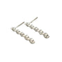 9ct white gold drop earrings featuring 0.25ct graduating diamonds in shared claw setting, handcrafted by Cassim & Co. Johannesburg