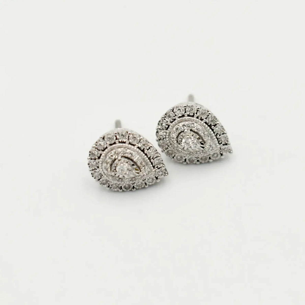 9ct white gold pear-shaped diamond halo stud earrings, 0.20 carat total weight, handcrafted by Cassim & Co. Johannesburg