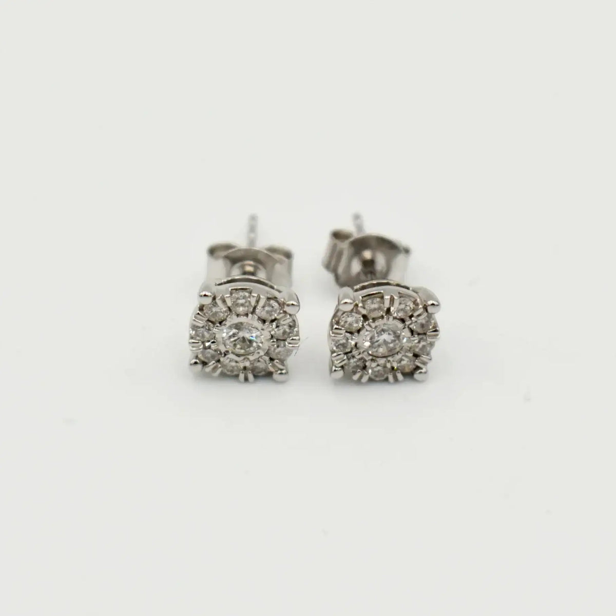 9ct white gold diamond cluster stud earrings featuring 0.33 carats of natural diamonds with butterfly backs by Cassim & Co
