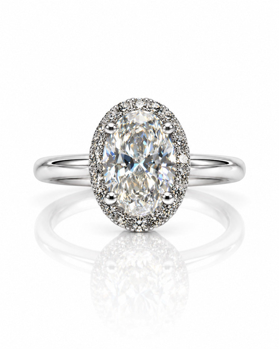 9ct white gold oval halo engagement ring with pavé diamonds and four claws on a slim polished band
