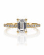 9ct yellow gold hidden halo ring with emerald cut lab-grown diamond and pavé-set band