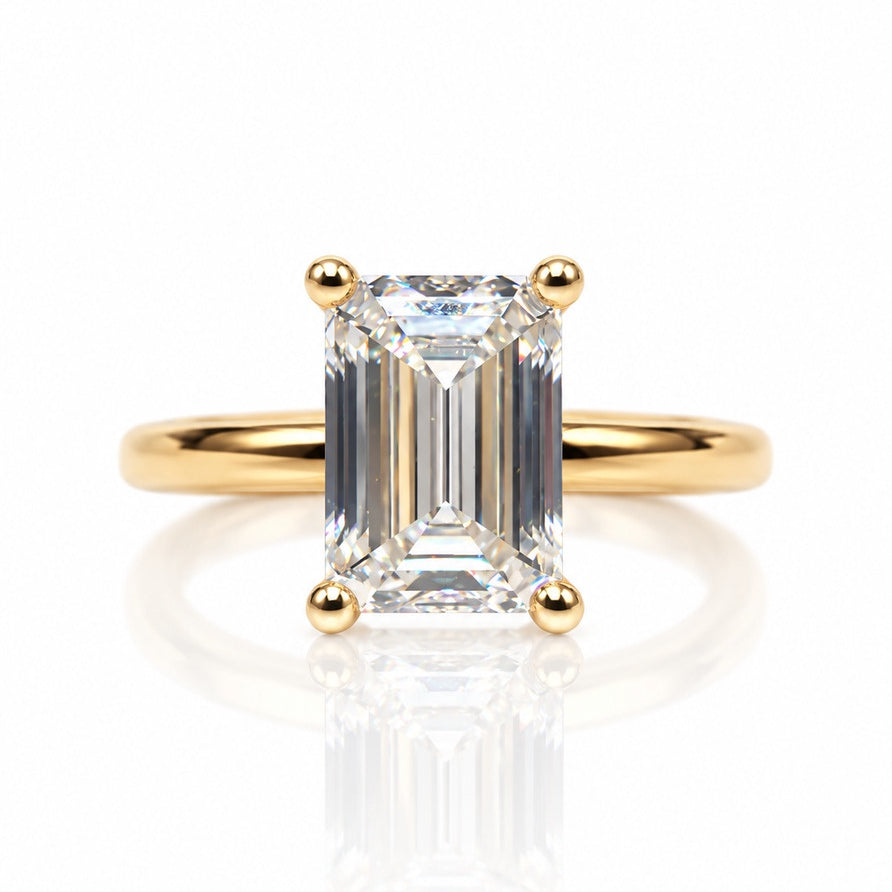 9ct yellow gold solitaire ring with emerald cut lab-grown diamond in four ball-tipped claws