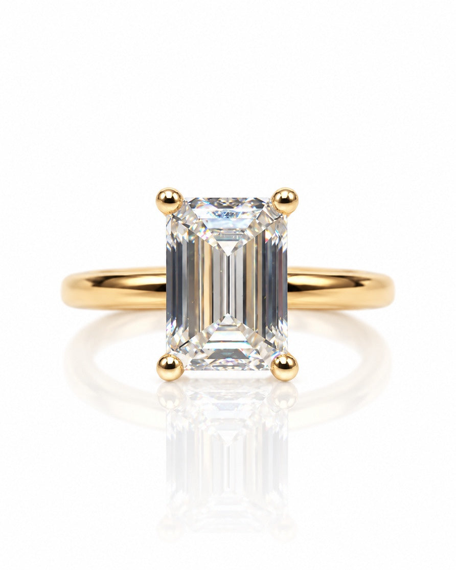 9ct yellow gold solitaire ring with emerald cut lab-grown diamond in four ball-tipped claws
