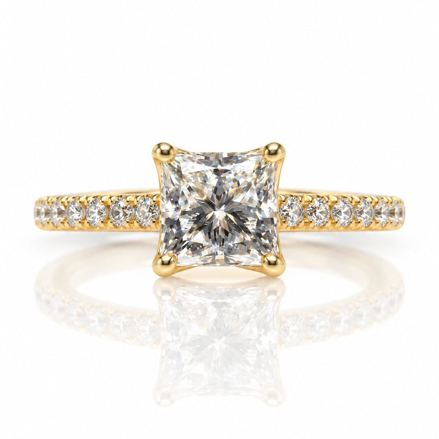 Yellow gold solitaire ring with princess-cut diamond in four-claw setting and pavé shoulders