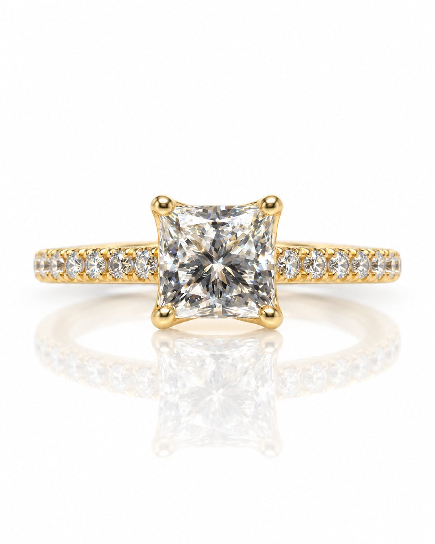 Yellow gold solitaire ring with princess-cut diamond in four-claw setting and pavé shoulders