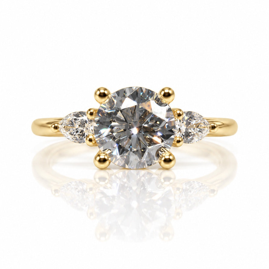 Trilogy engagement ring in 9ct yellow gold with round lab-grown diamond and two pear side stones
