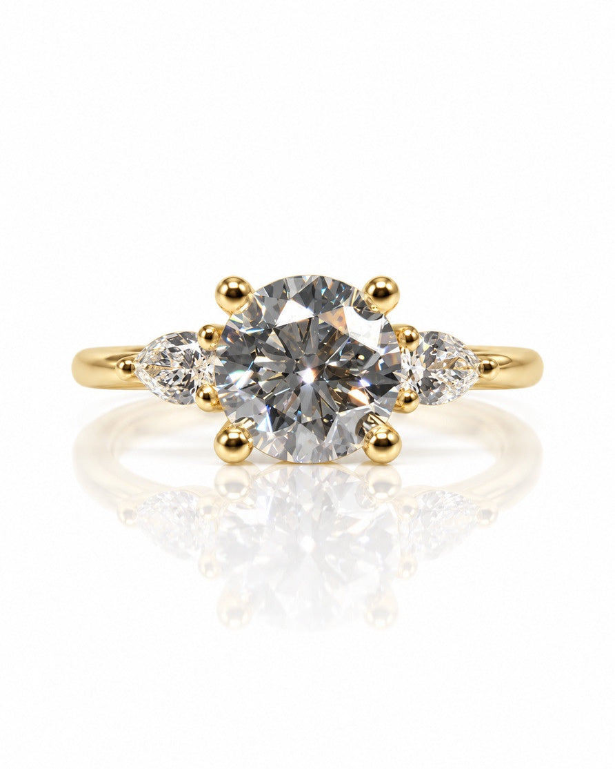 Trilogy engagement ring in 9ct yellow gold with round lab-grown diamond and two pear side stones
