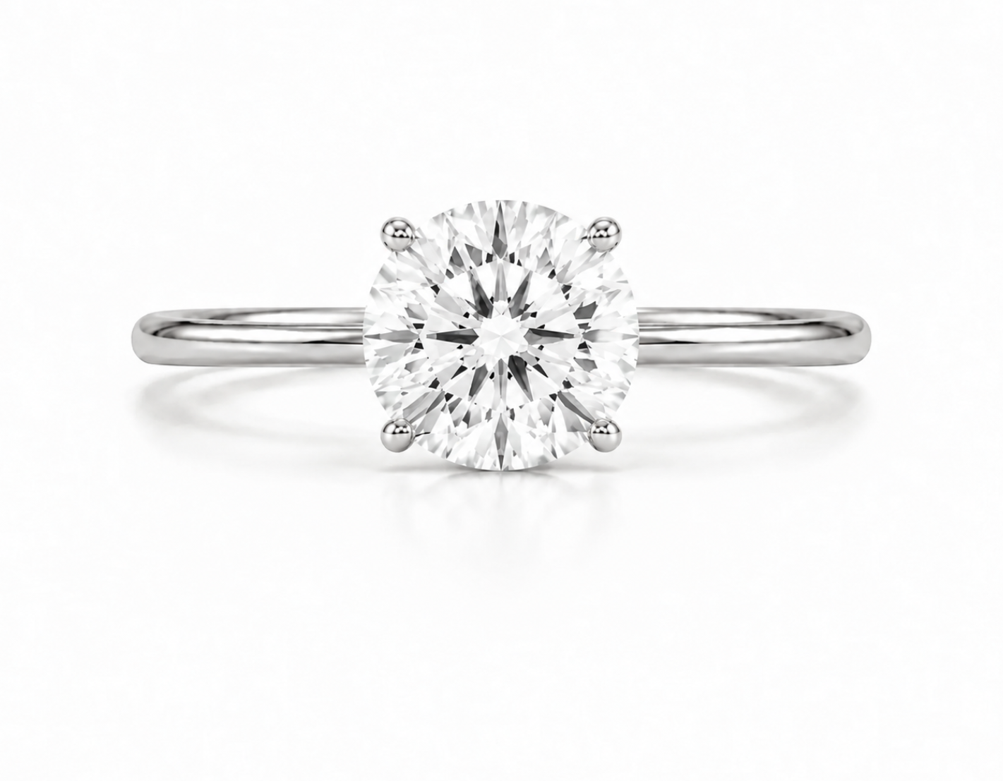 9ct white gold solitaire engagement ring with 2.00ct round lab grown diamond in four-claw setting on white background