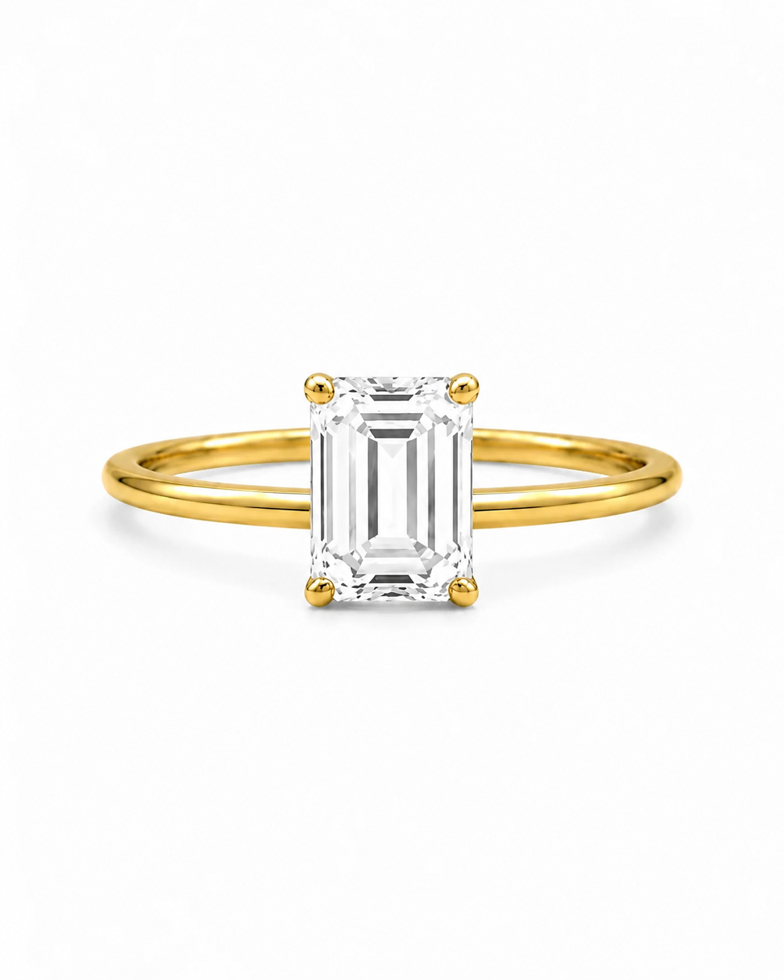 9ct yellow gold 2.00ct emerald cut lab grown diamond solitaire engagement ring with four-prong setting on white background