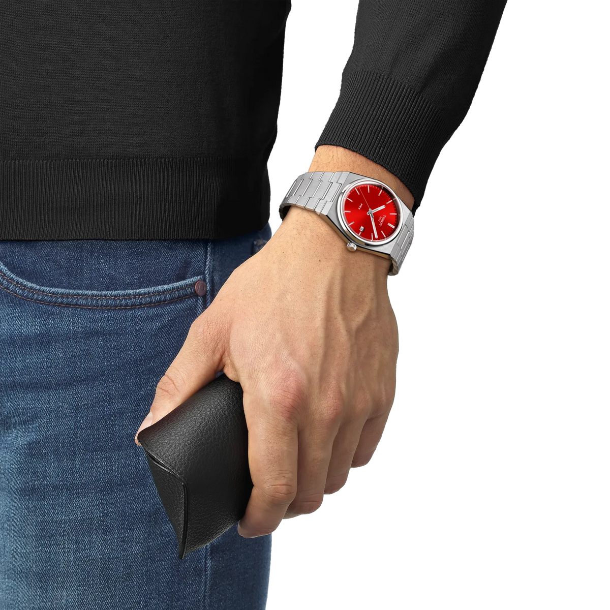 Tissot PRX 40mm worn on the wrist with red dial and steel bracelet