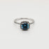 1ct blue cushion cut moissanite halo engagement ring in 9ct white gold with pavé band by Cassim & Co