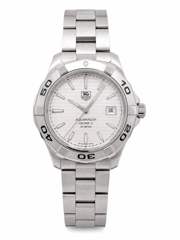 Pre-owned TAG Heuer Aquaracer Calibre 5 automatic dive watch with white textured dial and stainless steel bracelet on white background
