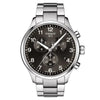 Tissot Chrono XL Classic quartz chronograph watch with black dial, white Arabic numerals, three subdials, and stainless steel bracelet on white background