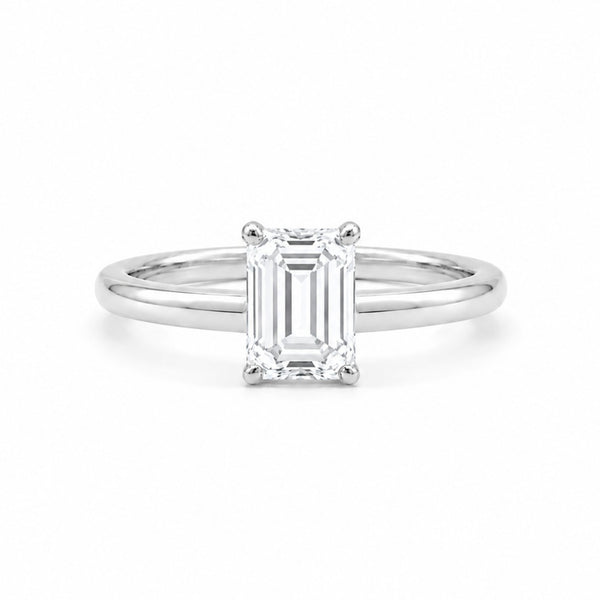9ct white gold engagement ring with 1.00ct emerald-cut lab grown diamond in four-prong solitaire setting on white background