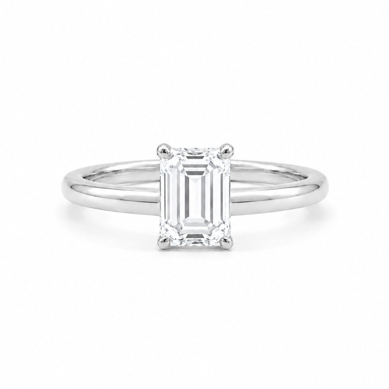9ct white gold engagement ring with 1.00ct emerald-cut lab grown diamond in four-prong solitaire setting on white background