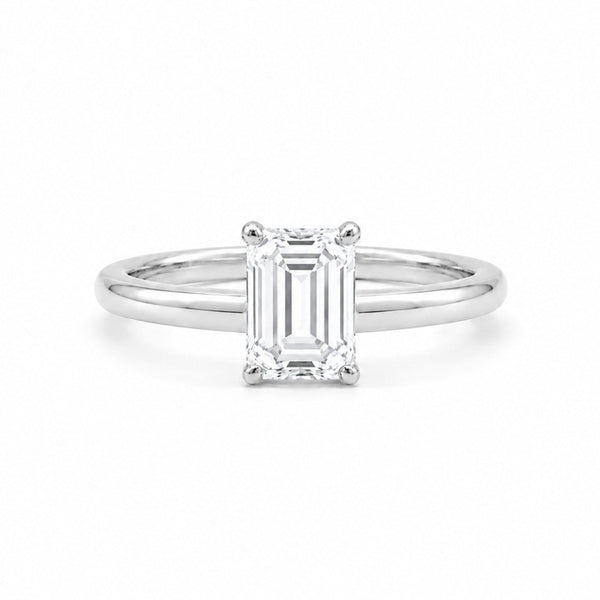 9ct white gold engagement ring with 1.00ct emerald-cut lab grown diamond in four-prong solitaire setting on white background