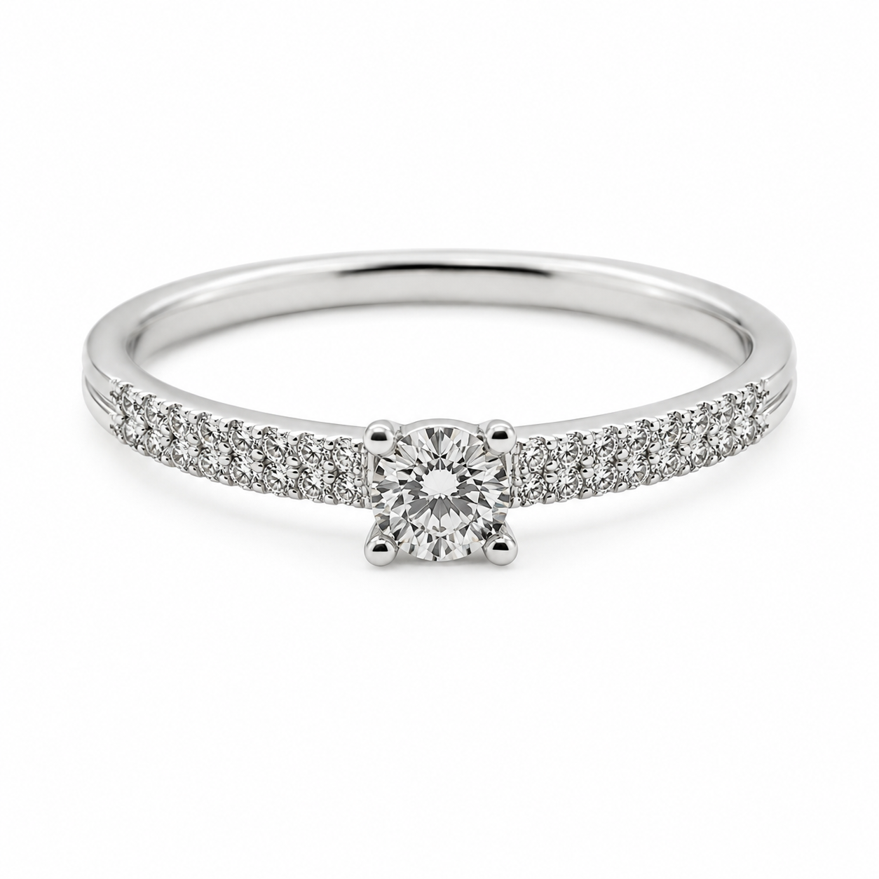 9ct white gold diamond engagement ring with round brilliant centre stone in 4-claw setting and pavé diamond band by Cassim & Co