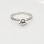1.00ct round moissanite engagement ring in sterling silver with 6-claw setting and pavé shoulders, Cassim & Co
