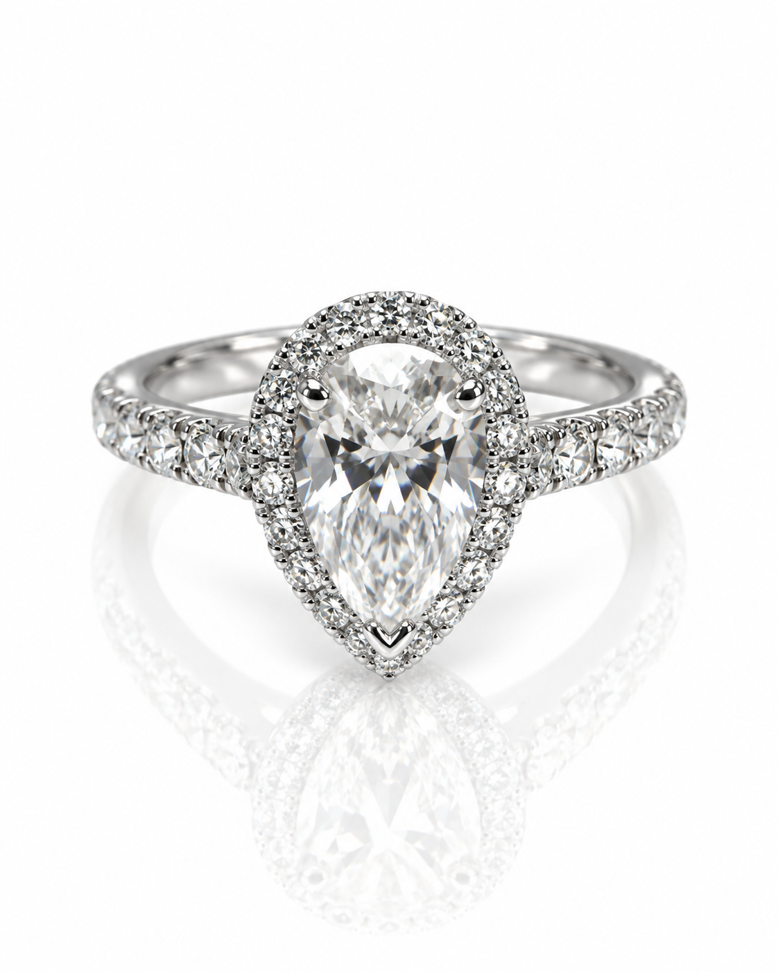 9ct white gold engagement ring with 1.5ct pear lab grown diamond in halo setting with pavé band, viewed from above on reflective surface