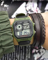 Green Casio digital watch on a wrist with multiple bracelets against a blurred background
