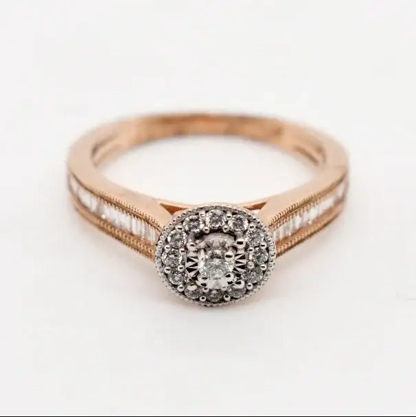 9ct rose gold diamond halo engagement ring with channel-set shoulders and milgrain detailing