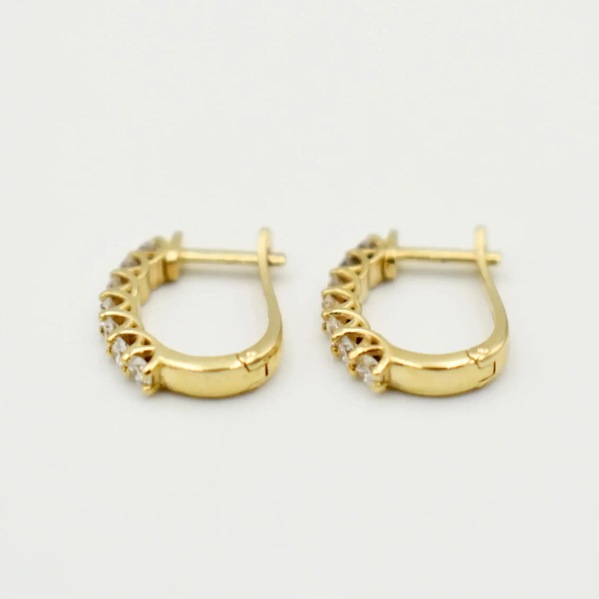 9ct yellow gold hoop earrings with 0.50ct lab grown diamonds featuring hinged clasp closure