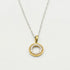 9ct white gold circle pendant necklace with 0.10ct diamonds and yellow gold bail on white background