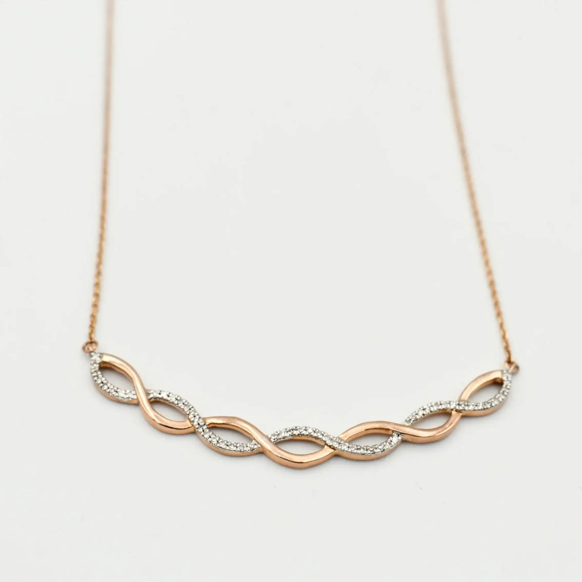 9ct rose gold diamond infinity necklace with 0.15ct pavé diamonds on delicate chain