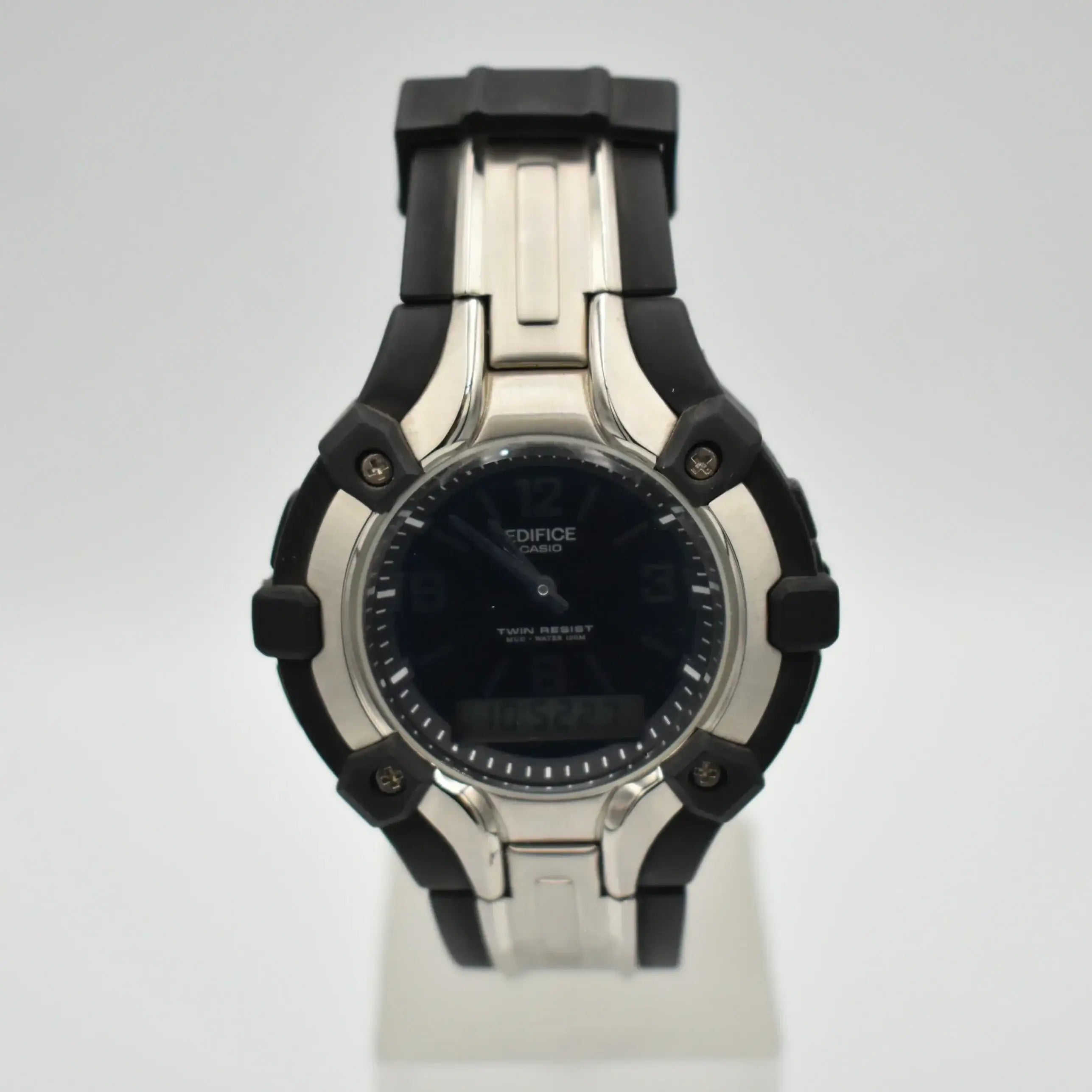 Casio Edifice AMW-200 ana-digi quartz watch with black dial, stainless steel case, and black resin strap on white display stand