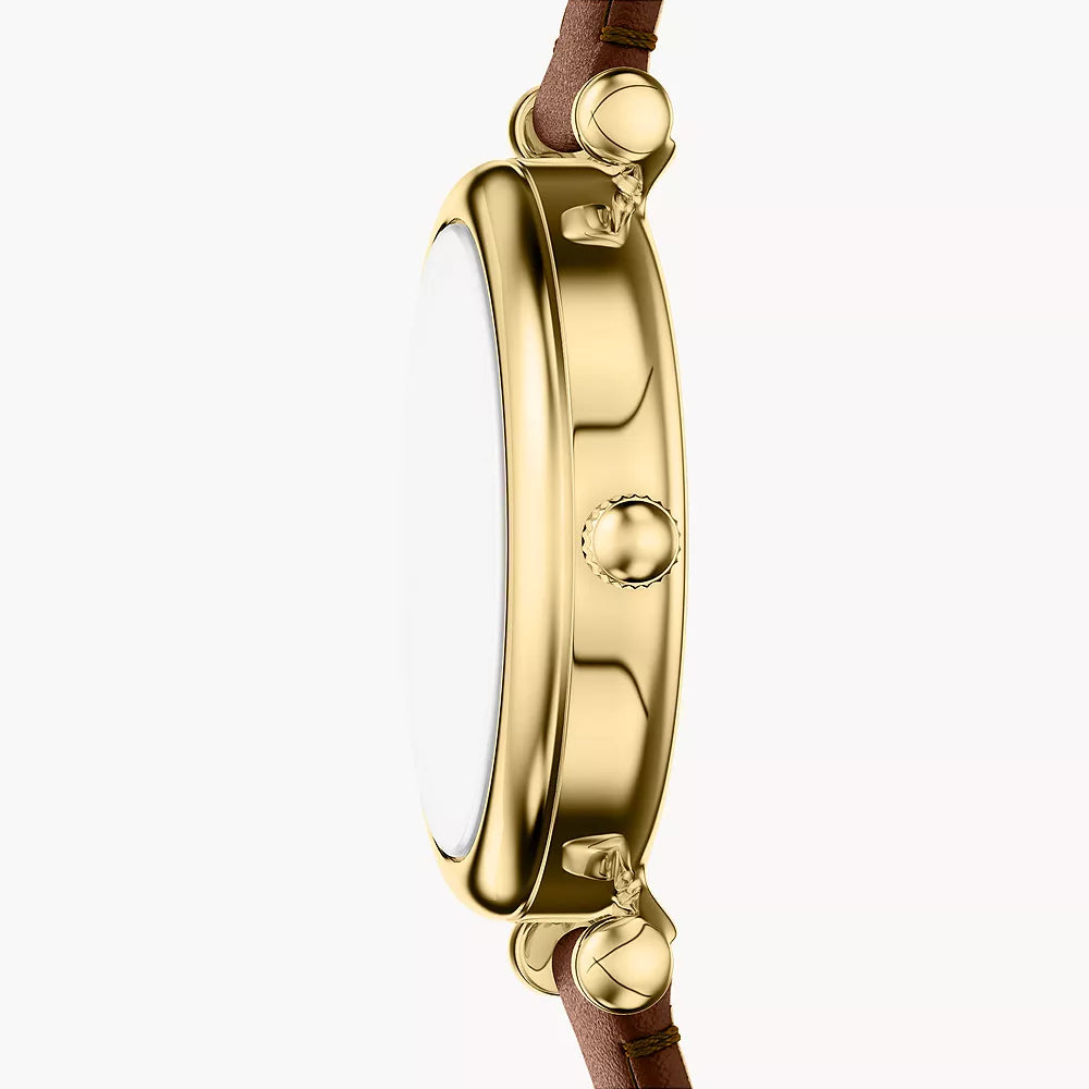 Gold-tone bezel and Roman numerals at 12 and 6 on white dial