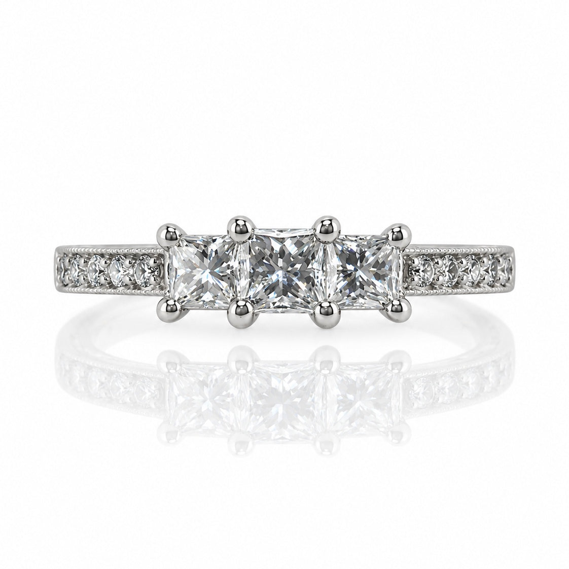 9ct white gold trilogy engagement ring with three princess-cut diamonds and pavé shoulders