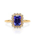9ct yellow gold halo engagement ring with emerald cut tanzanite and pavé diamond halo