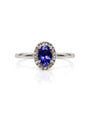 9ct white gold engagement ring with oval tanzanite centre stone and diamond halo