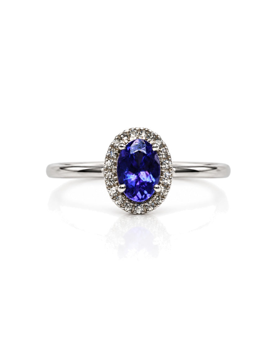 9ct white gold engagement ring with oval tanzanite centre stone and diamond halo
