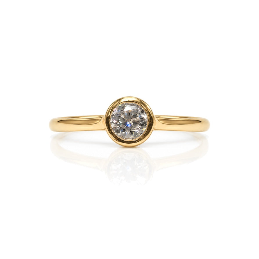 9ct yellow gold engagement ring with 0.25 carat round diamond in bezel setting