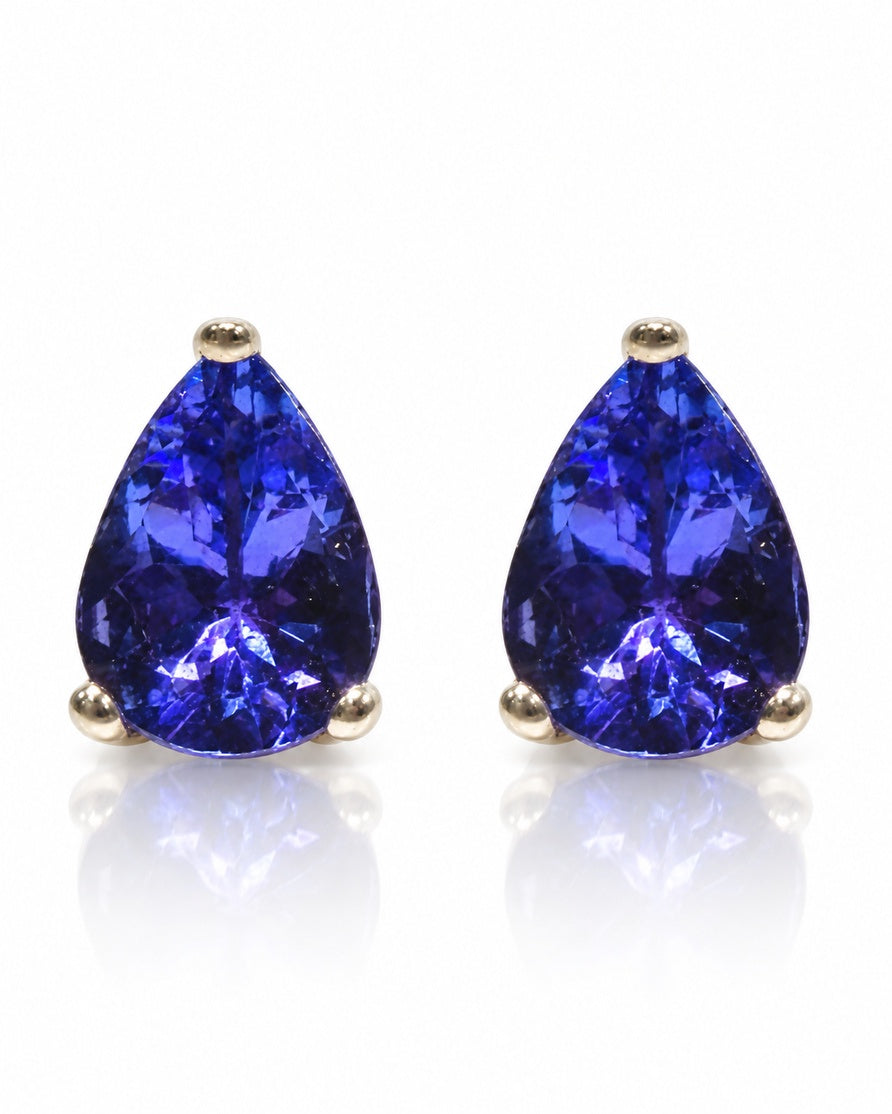 Pair of pear-cut blue tanzanite stud earrings in 9ct white gold three-claw settings
