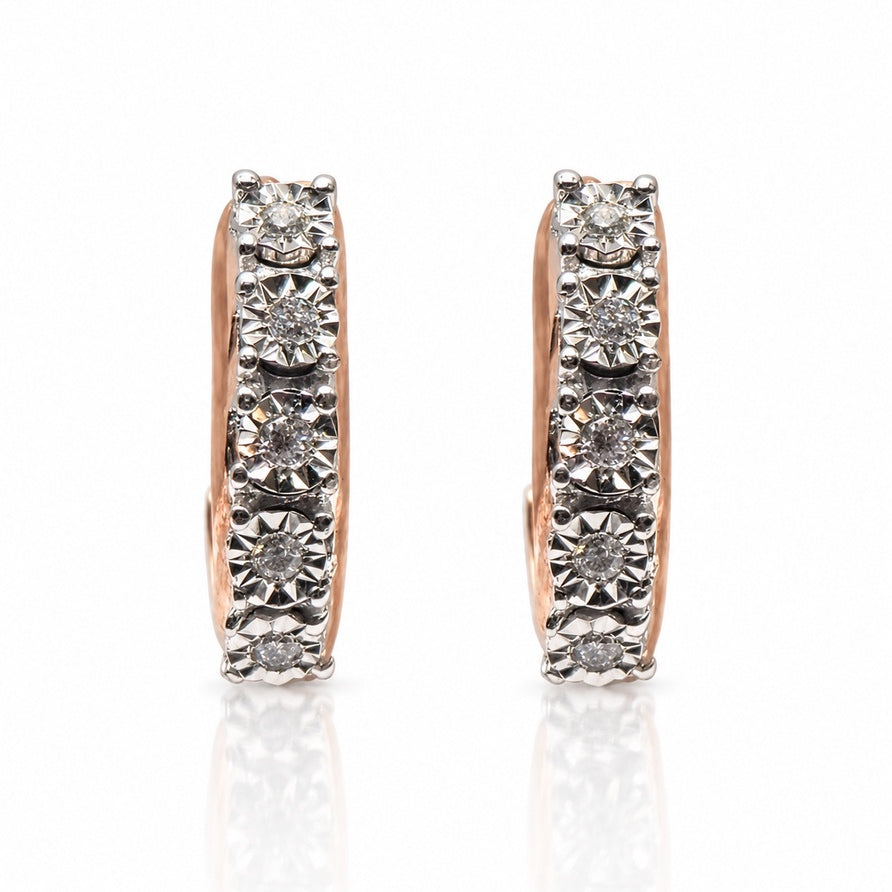 Rose gold huggie earring with five illusion-set round diamonds in a vertical row