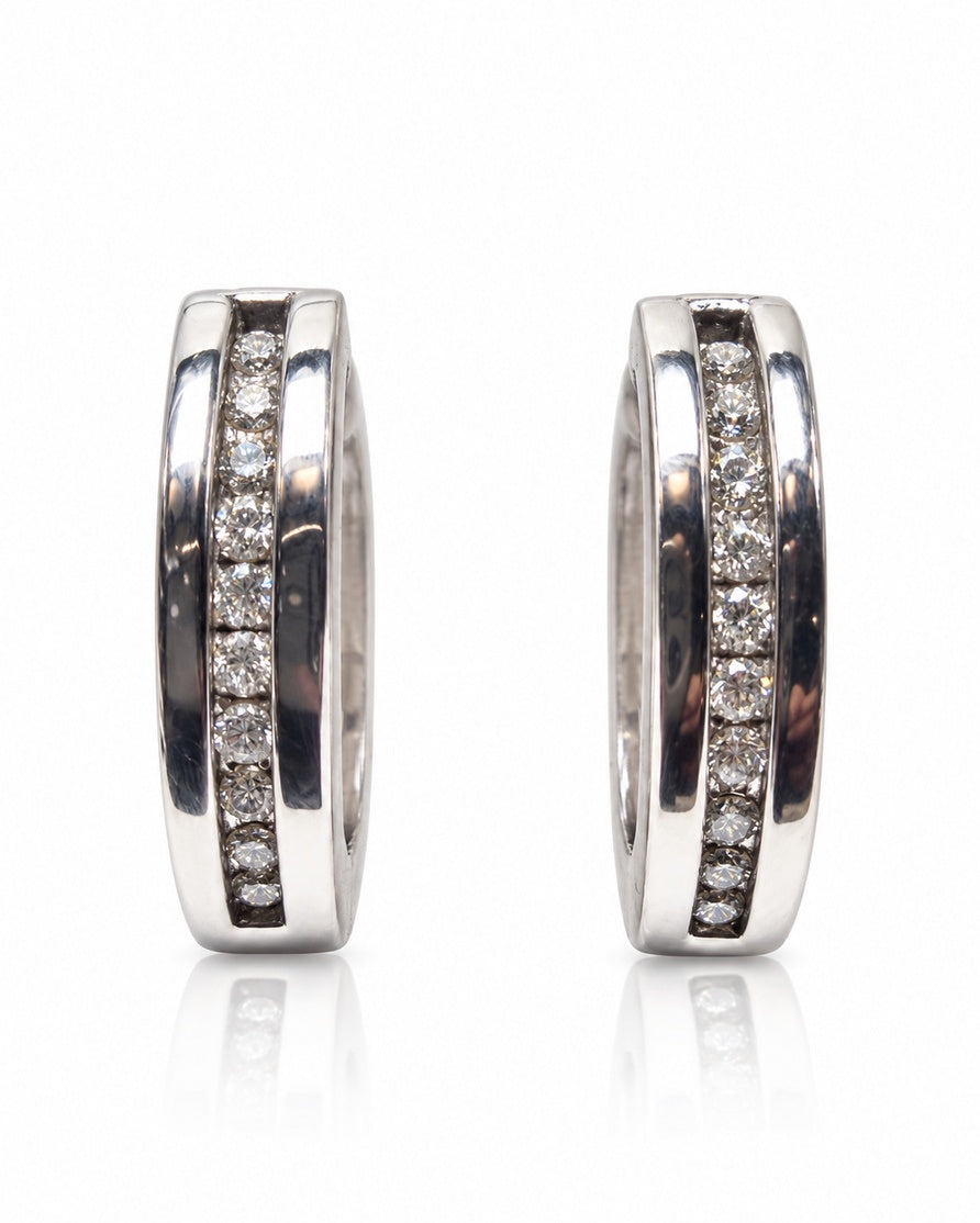 Pair of 9ct white gold huggie earrings with channel-set round diamonds and polished rails