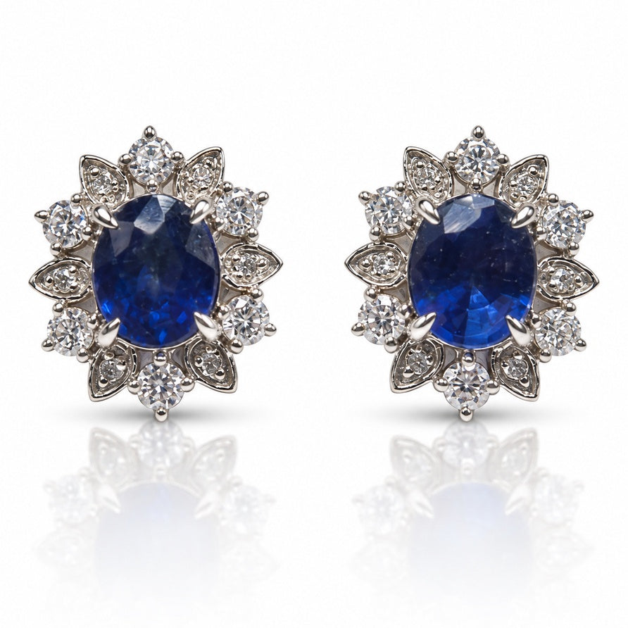 18ct white gold stud earring with oval blue sapphire and diamond floral halo