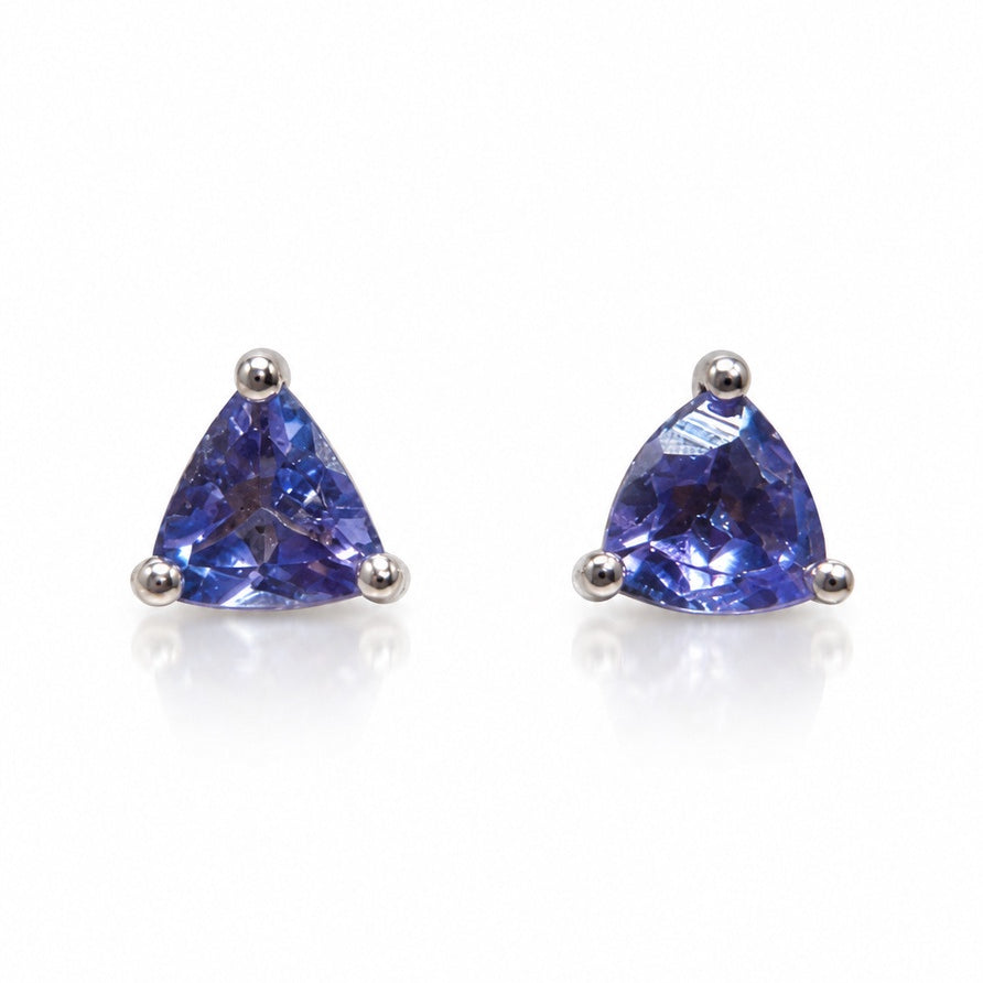 Pair of 9ct white gold stud earrings with trillion tanzanites in three-claw settings
