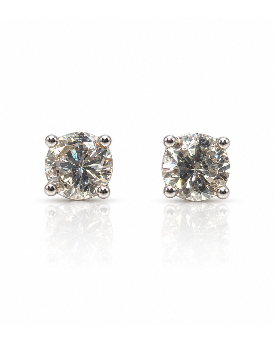 Pair of 9ct white gold four-claw stud earrings with round brilliant diamonds